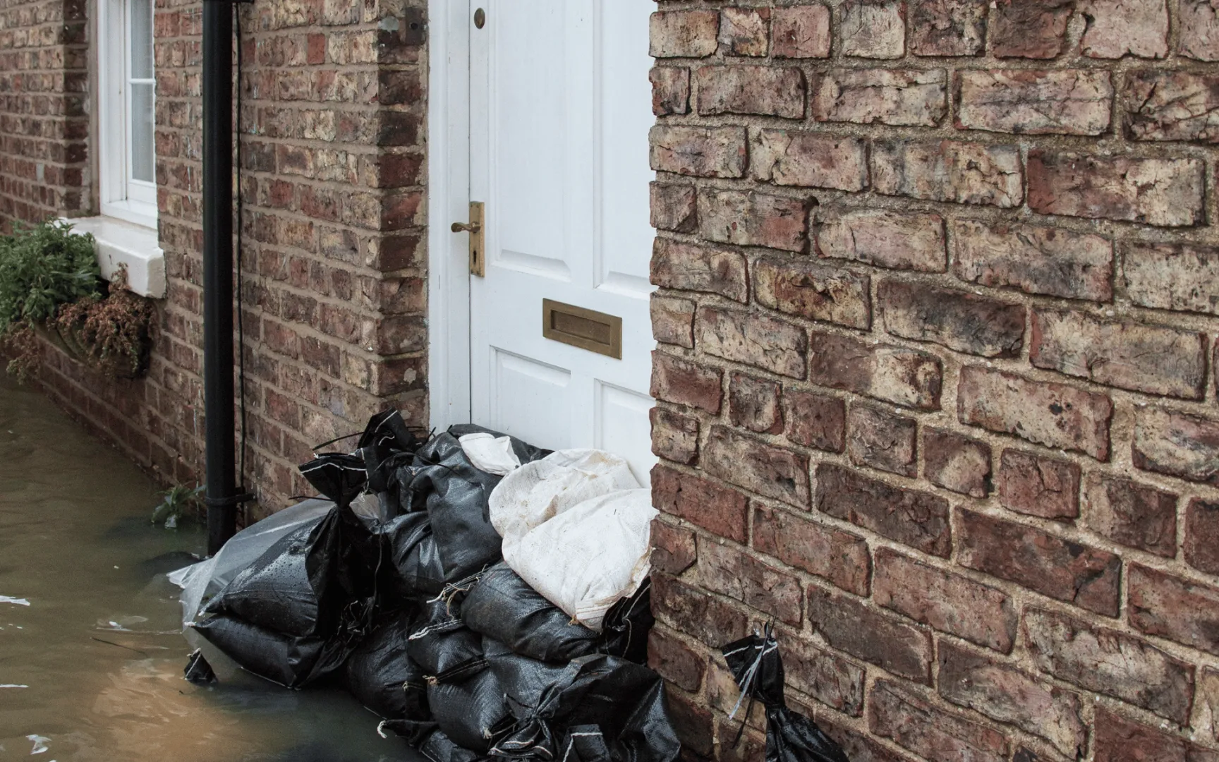Sandbags, flooded home